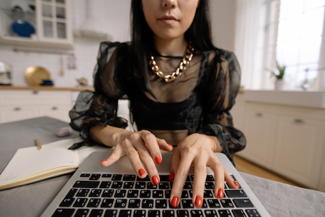 a person typing on a laptop
